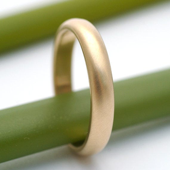A timeless 14k gold wedding ring by KyleAnneMetals on 