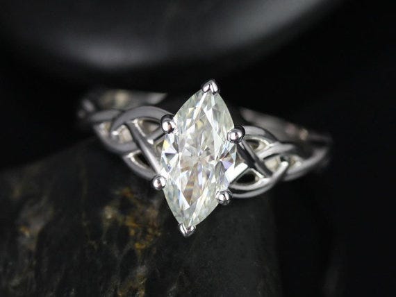 This Celtic-inspired ring by RosadosBox on Etsy features a gorgeous marquise cut moissanite stone