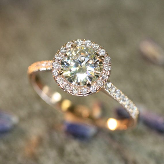 We love rose gold! And halos, of course. This ring from LaMoreDesign on Etsy has both!