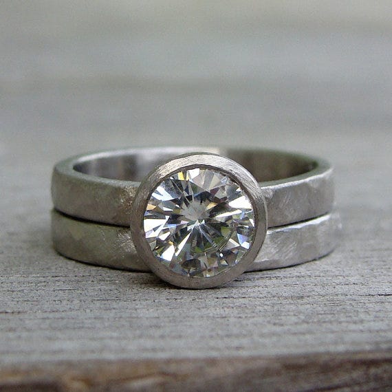 McFarlandDesigns uses only recycled metals in her work. This moissanite engagement ring and matching wedding band feature recycled palladium