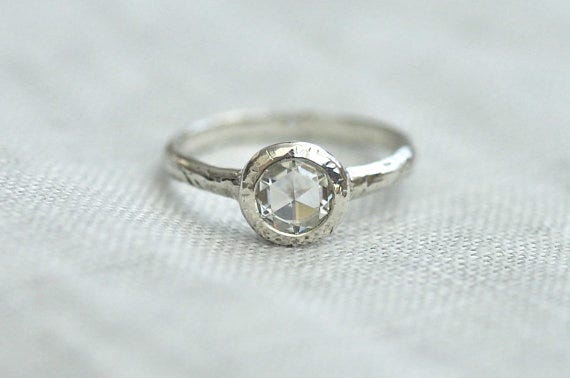 This modern moissanite engagement ring features a rose cut stone. Porter Gulch, $330