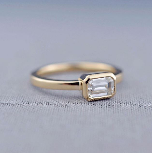 This minimalist solitaire engagement ring from Lily Emme Jewelry is so dainty and lovely! 